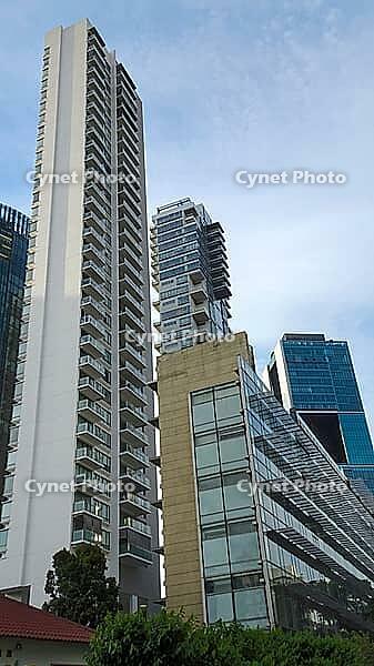 Dramatic perspective of high-rise buildings with glass facades standing out against the blue sky, Singapore, Singapore [IBR123769658]