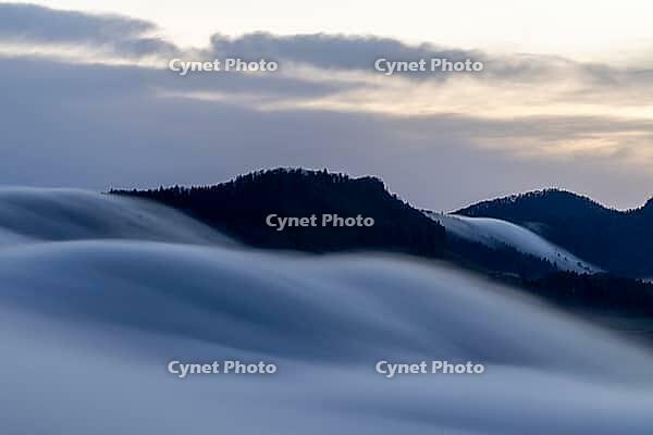 Fog flow, high fog flows over Unteren Hauenstein Pass into the Basel area, long exposure, Wisenberg, Baselland, Switzerland [IBR123769692]