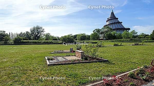 A well-maintained park with benches and the Millennium Tower in Magdeburg in a quiet atmosphere, Magdeburg, Germany [IBR123769721]