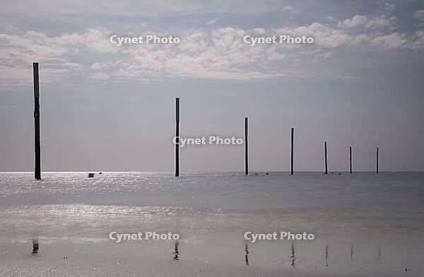 Piles on the beach, St.Peter Ording, Wadden Sea National Park, Schleswig-Holstein, Germany [IBR123773524]