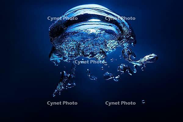 Abstract underwater oxygen bubble with blue backdrop [IBR123878843]