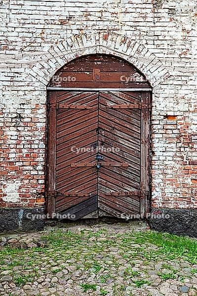 Old wooden gate at the medieval castle in Vyborg, Russia [IBR123878846]