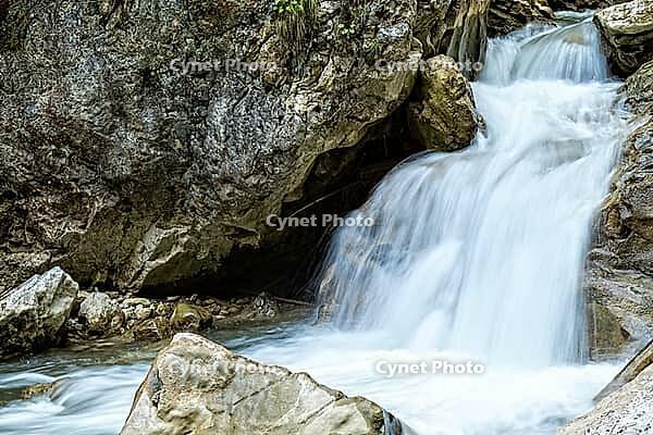 Raging clean fresh mountain river flowing between rocks [IBR123878893]
