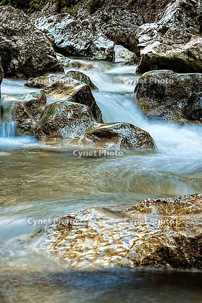 Raging clean fresh mountain river flowing between rocks [IBR123878894]