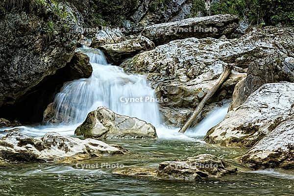 Raging clean fresh mountain river flowing between rocks [IBR123878907]