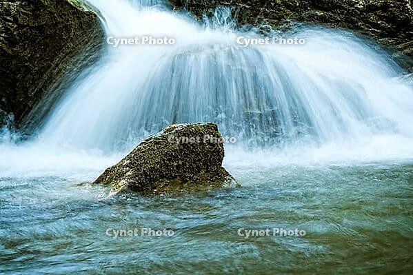 Raging clean fresh mountain river flowing between rocks [IBR123878915]