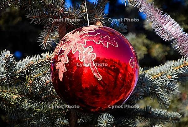 Tinsel and toys, balls and other decorations on the Christmas Christmas tree standing in the open air. Atyrau, Kazakhstan, Eurasia [IBR123893321]