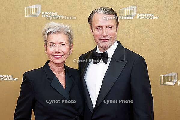 Mads Mikkelsen with woman Hanne Jacobsen, EUROPEAN FILM AWARDS Berlin 2026, photo call at the House of World Cultures, Berlin, 17.01.2026 [IBR112941831]