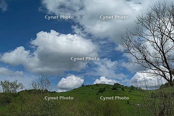 Cluster clouds (cumulus) over the landscape in the southern Carpathian Arc, Romania [IBR123990965]