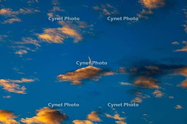 Aircraft contrails with red clouds, sunrise, Upper Austria [IBR123990982]