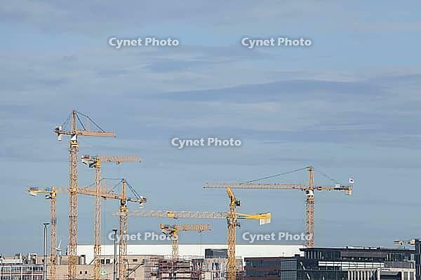 Construction cranes in the Überseestadt of Bremen, scaffolding, construction site, Bremen [IBR123999821]