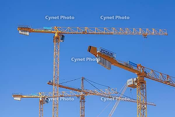 Construction cranes in the Überseestadt of Bremen, scaffolding, construction site, Bremen [IBR123999823]