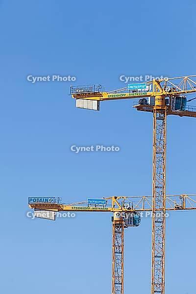 Construction cranes in the Überseestadt of Bremen, scaffolding, construction site, Bremen [IBR123999825]