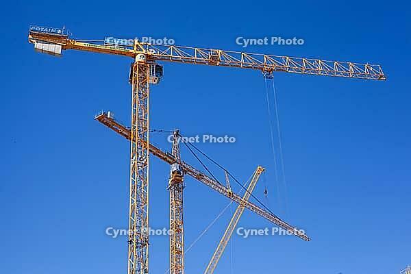 Construction cranes in the Überseestadt of Bremen, scaffolding, construction site, Bremen [IBR123999827]