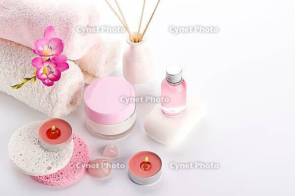 Spa setting and health care items, body lotion, soap, aroma sticks, oil, sponges and towels [IBR123999897]