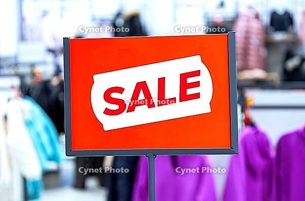 Super price sign on blurred background at a clothes store, close up [IBR124036434]