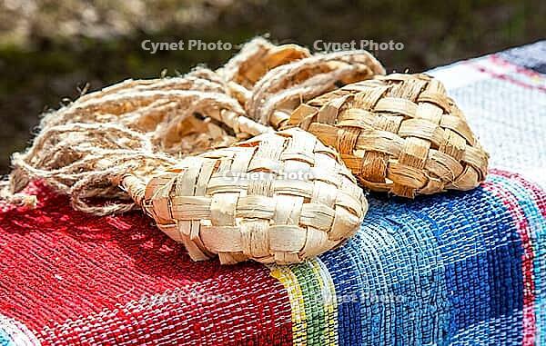 Birchen woven bast shoes traditional Russian footwear. Wicker bast shoes on the vintage homespun doormat [IBR124036450]