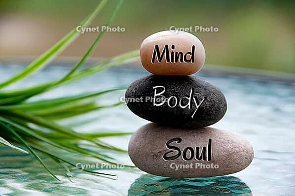 Mind, Body and Soul words engraved on zen stones with space for text. Copy space and zen concept [IBR124083606]