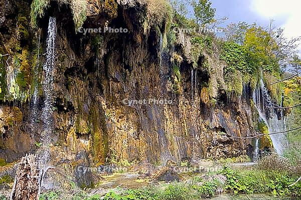Long limestone wall with small waterfalls in the nature park, Plitvice Lakes, Lika-Senj County, Croatia [IBR124084172]