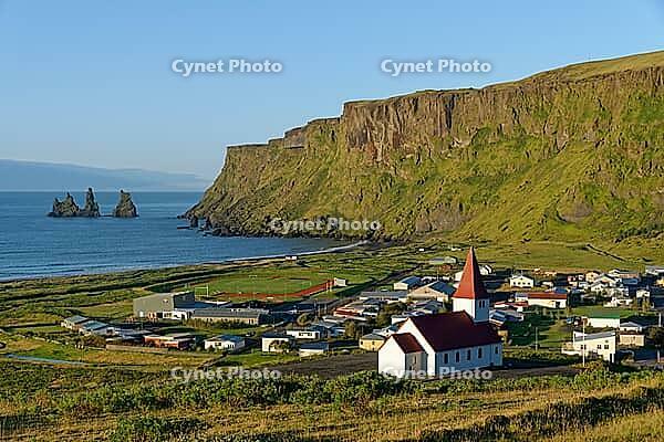 Vík í Mýrdal church, view over Vik and Reynisdrangar rocks, Vik, South Iceland, Iceland [IBR124192802]
