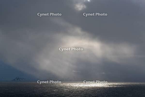 Dramatic lighting over the Norwegian European Sea, Söröya, Finnmark, Norway, March 2019 [IBR124200495]