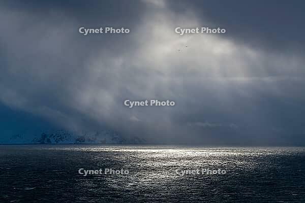 Dramatic lighting over the Norwegian European Sea, Söröya, Finnmark, Norway, March 2019 [IBR124200498]