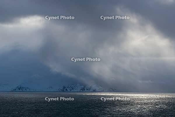 Dramatic lighting over the Norwegian European Sea, Söröya, Finnmark, Norway, March 2019 [IBR124200499]