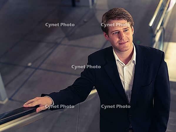 Portrait of young handsome Scandinavian businessman at the airport in the city [IBR124309041]
