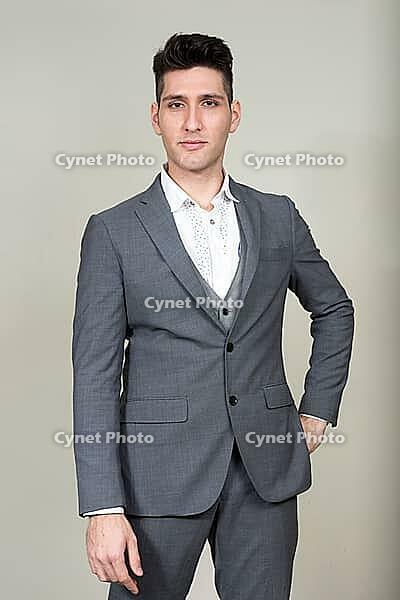 Studio shot of young multi ethnic businessman against white background [IBR124309053]