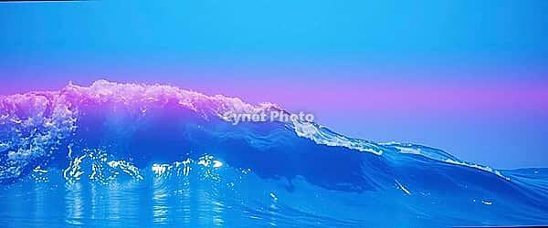 Combination of pink and blue waves with sunset reflections on the horizon, blue water and wave background, AI generated [IBR124458829]