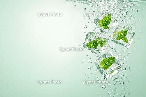 Ice cubes with mint leaves sink in sparkling water on green background, healthy food, AI generated [IBR124458837]