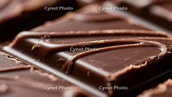 Close-up of a piece of dark chocolate with fine relief, delicious chocolate, presented in a stalk, AI generated [IBR124458857]