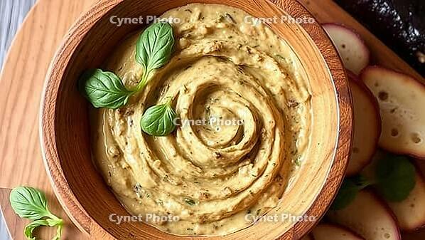 Creamy dip in a wooden bowl, decorated with basil leaves and potatoes, delicious dip, perfect as a side dish for meals and parties, AI generates, AI generated [IBR124458875]