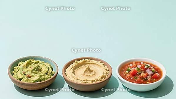 Three bowls with different dips on a pastel background, delicious dip, perfect as a side dish for meals and parties, AI generated [IBR124458887]