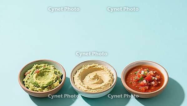 Three bowls of guacamole, hummus and salsa on a blue background, delicious dip, perfect as a side dish for meals and parties, AI generates, AI generated [IBR124458891]