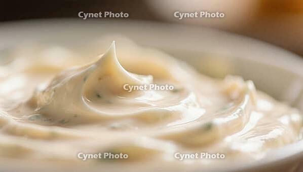 Close-up of a creamy substance with fine texture and soft lighting, delicious dip, perfect as a side dish for meals and parties, AI generates, AI generated [IBR124458892]