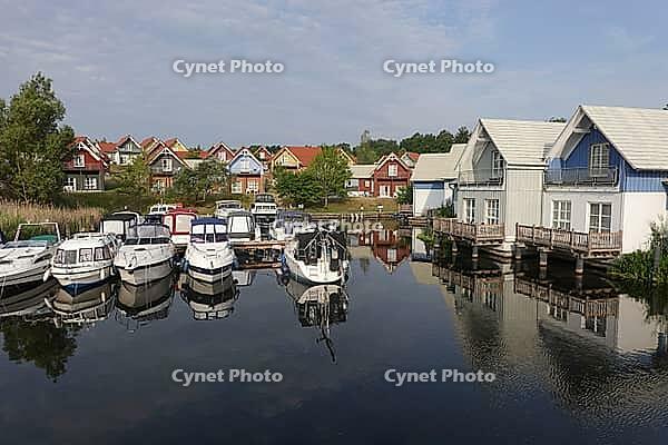 Charter boats and holiday homes in Marina Wolfsbruch, Rheinsberg, Brandenburg, Germany [IBR124494810]