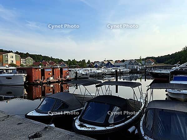 Charter boats and holiday homes in Marina Wolfsbruch, Rheinsberg, Brandenburg, Germany [IBR124494824]