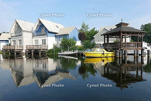 Charter boats and holiday homes in Marina Wolfsbruch, Rheinsberg, Brandenburg, Germany [IBR124494832]
