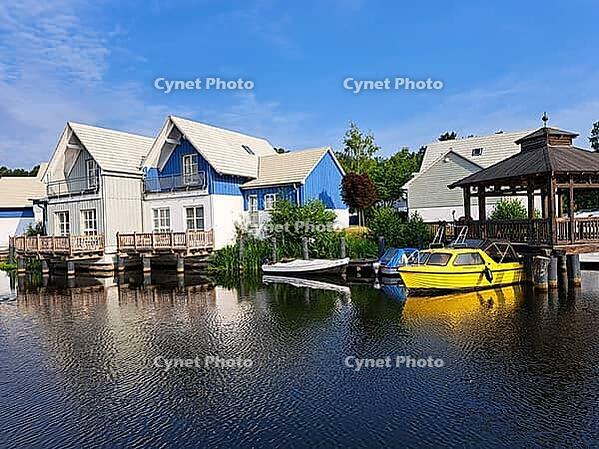 Charter boats and holiday homes in Marina Wolfsbruch, Rheinsberg, Brandenburg, Germany [IBR124494834]