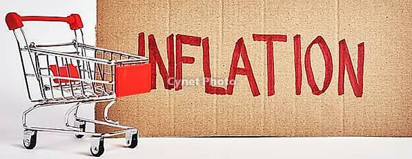 Consumers inflation concept, Rising living costs, Shopping trolley and word inflation [IBR124497418]