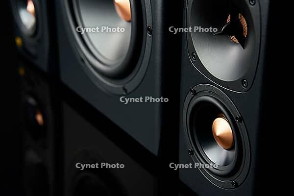 Two sound speakers and subwoofer on dark background. Set for listening music. Audio equipment [IBR124497431]