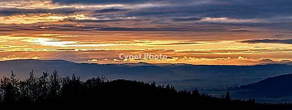 Sunset with dramatic cloudy sky over mountains shape, beautiful nature landscape [IBR124497434]