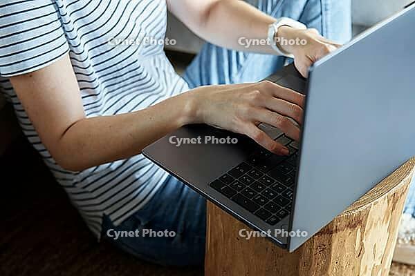 Working from home concept. Woman jands typing on laptop keyboard. Remote work from home workplace [IBR124497447]