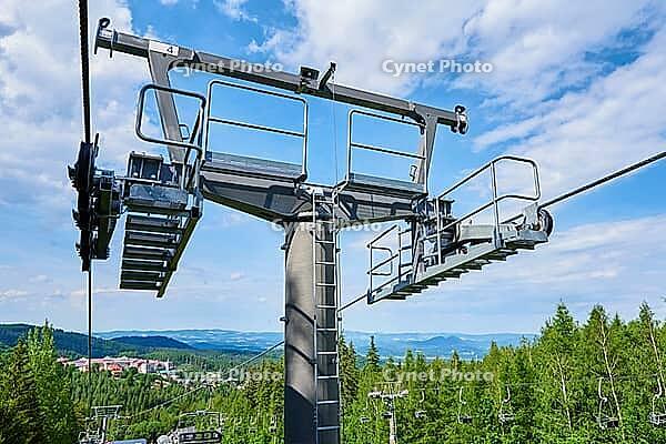 Open cable car line. Metal cable and moving rollers on platform for funicular mechanism, close up. Karpacz resort in Poland with lift road [IBR124497450]