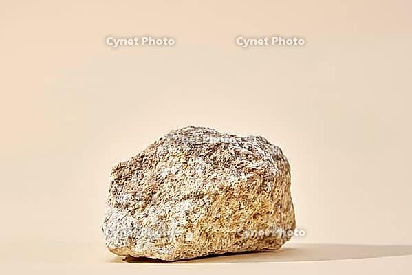 Natural granit stone on beige background, minimal product podium [IBR124497460]