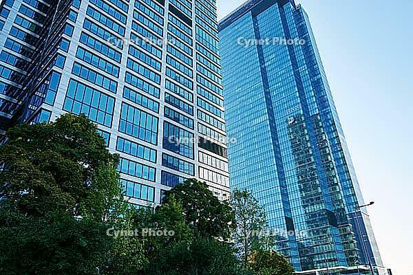 Detail of glass office building facade with reflections. Modern city architecture [IBR124497469]