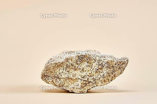 Natural granit stone on beige background, minimal product podium [IBR124497475]