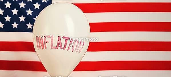 Economic crisis and inflation concept, Balloon with word inflation against usa flag, Rising prices for consumer goods and services [IBR124497488]