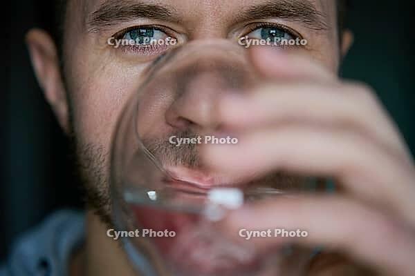 Man drinks water, Close-up shot of bearded man drinking fresh clean water from glass, Quenching thirst, Lifestyle healthcare concept [IBR124497494]